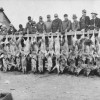 Hunters with their caught coyotes