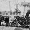 Jerry Mitchell with trash collecting vehicle, c.1912