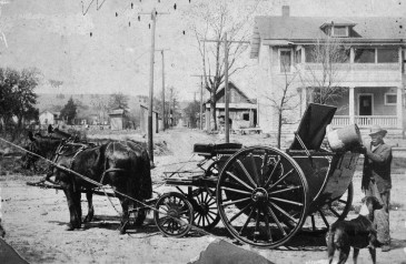 Jerry Mitchell with trash collecting vehicle, c.1912